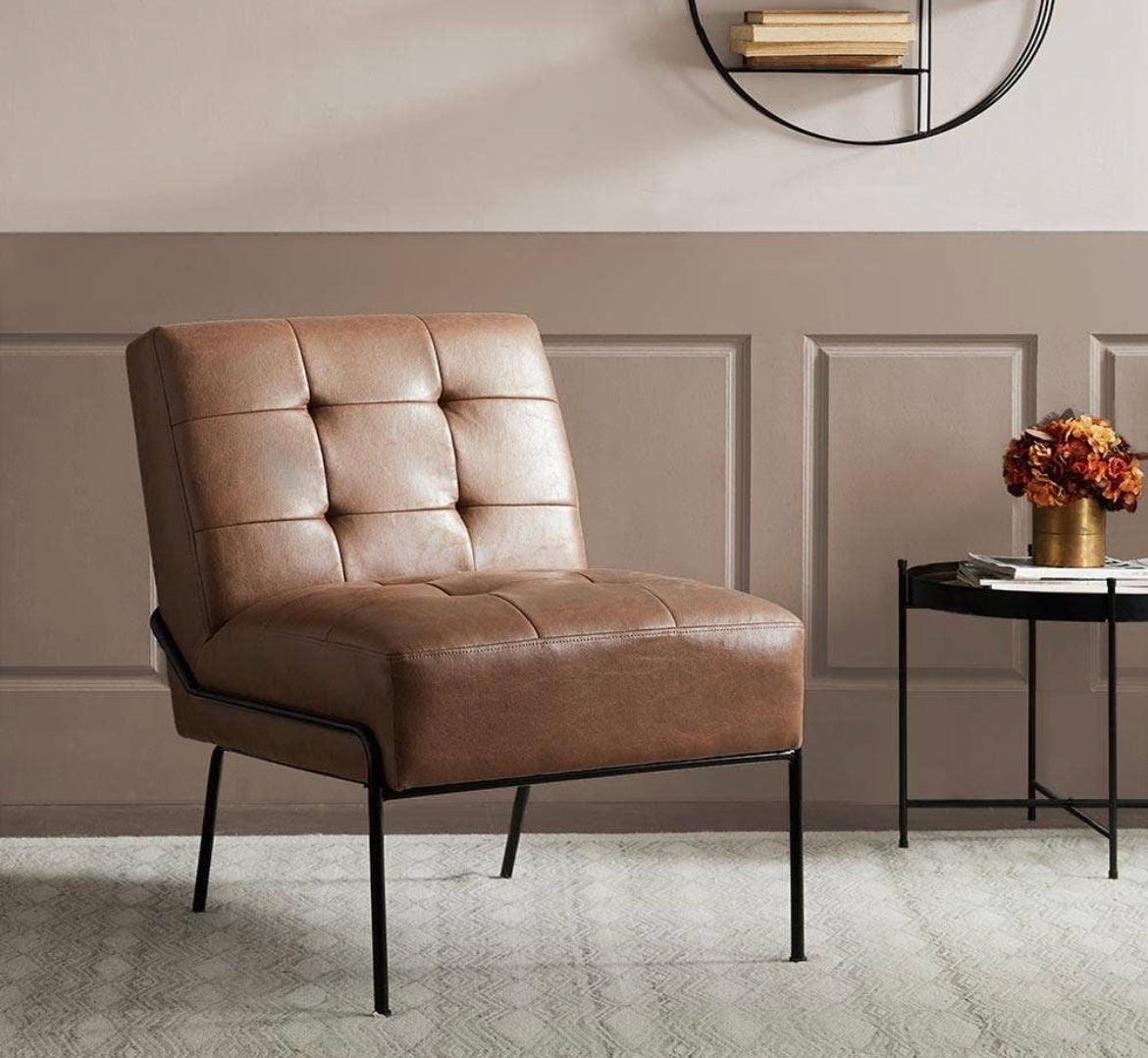 Tufted armless leather chair